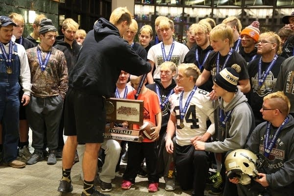 In postgame celebration, Caledonia champs make a hospital visit