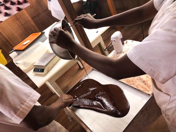 A worker pours chocolate at a factory in Africa's São Tomé. The continent's smallest economy was once the world biggest cocoa exporter. Although it now produces just a fraction of global consumption, growers insist it's quality over quantity that matters to consumers