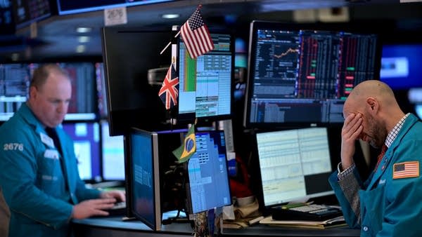 Traders work during the closing bell at the New York Stock Exchange (NYSE) on February 24, 2020 at Wall Street in New York City.