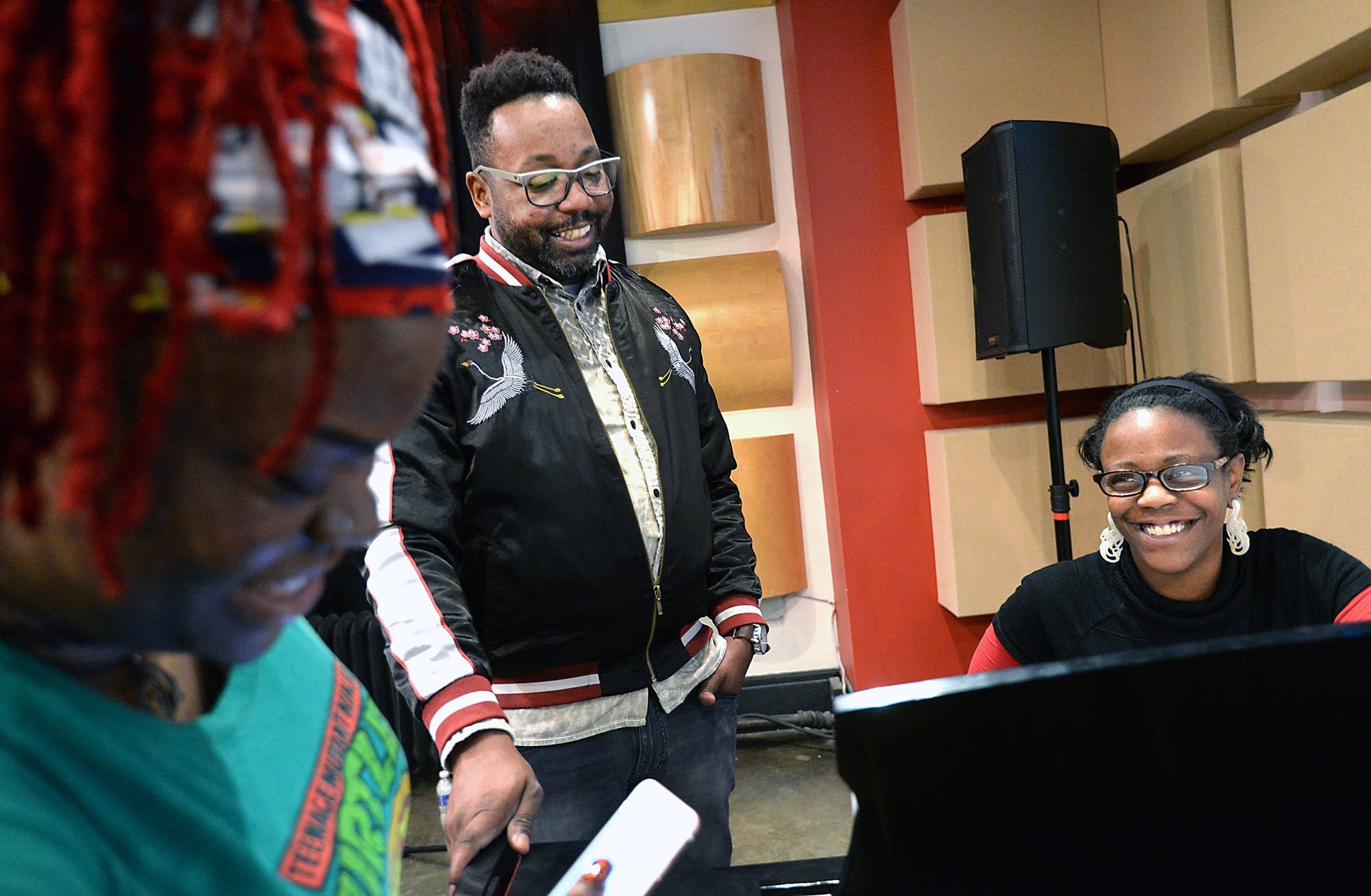 Strange works with vocalist Tabbie Sabali, left, and pianist Erica Orton.