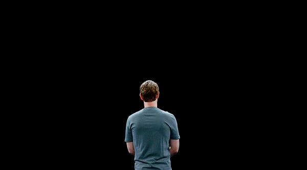 Facebook has clarified its policy that websites that spread false news can't use its ad-selling network. Above, Facebook founder and CEO Mark Zuckerberg gives a speech in Barcelona, Spain.