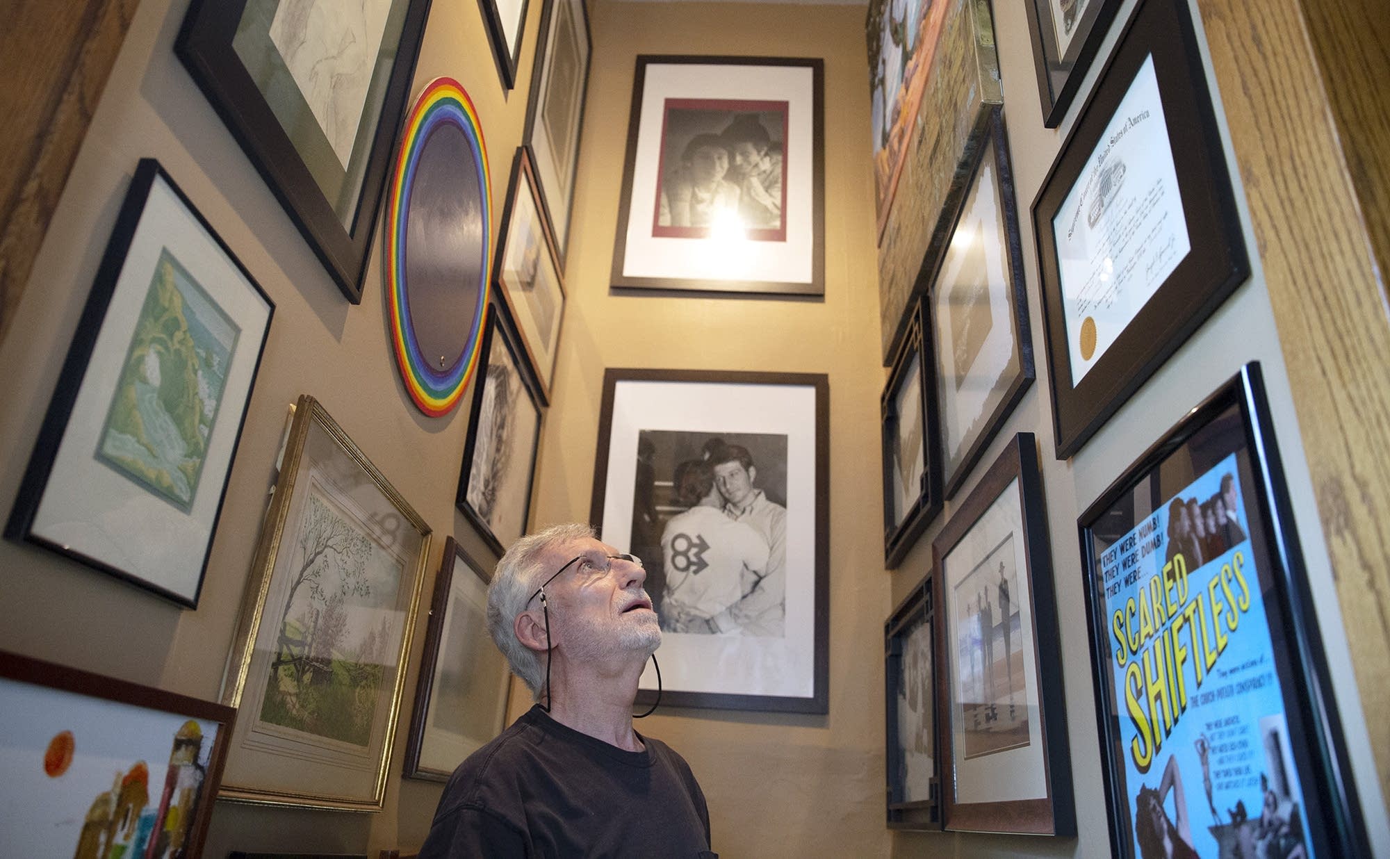 Michael McConnell talks about artwork and photographs in his hall.
