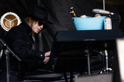 Dope Lemon performing on an outdoor stage.