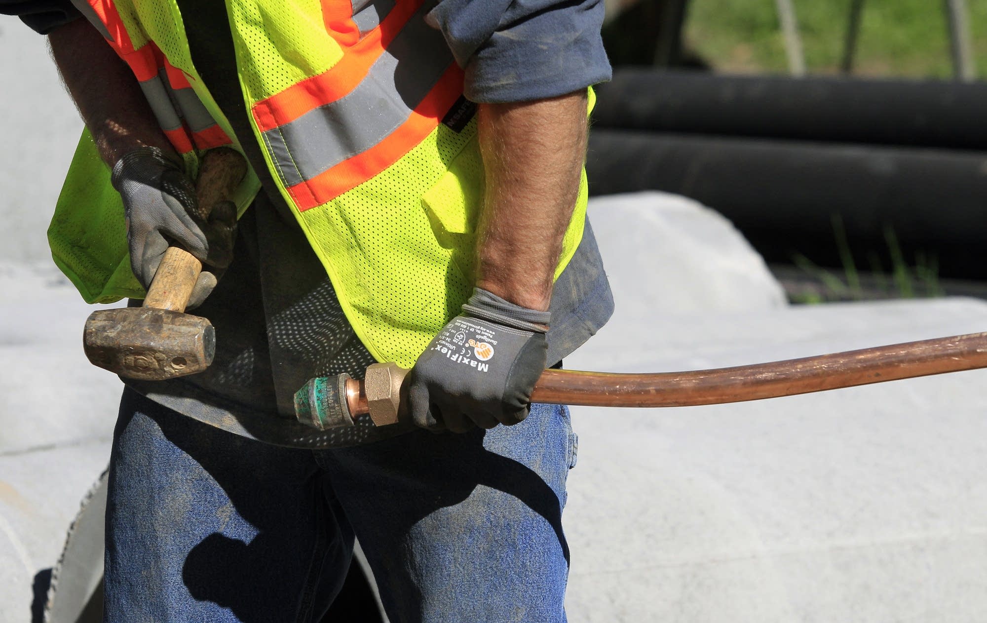 Preparing copper piping.
