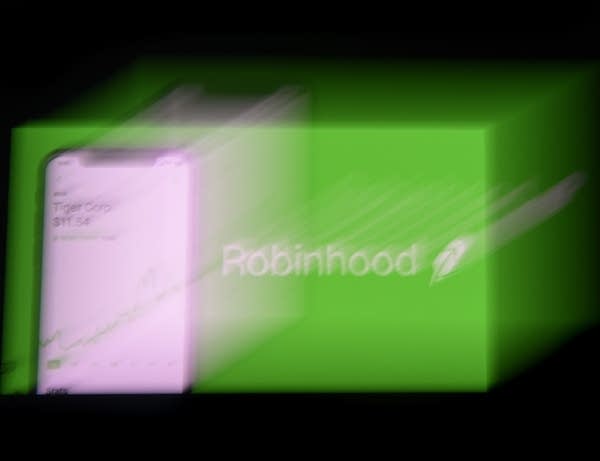 This photo illustration shows the logo of trading application Robinhood on a mobile phone in Arlington, Virginia on January 28, 2021. 