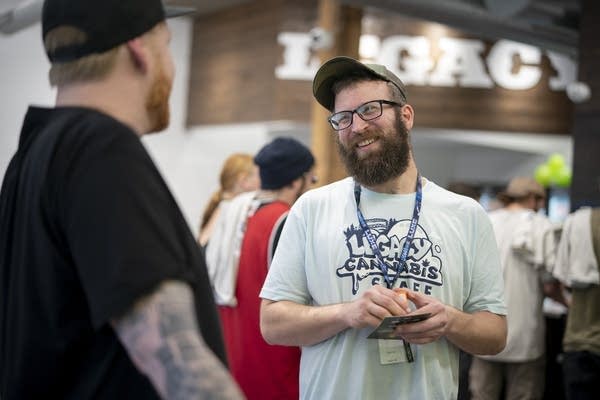 Two people talk in a store