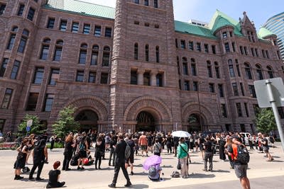 Protesters gather near City Hall and the federal courthouse