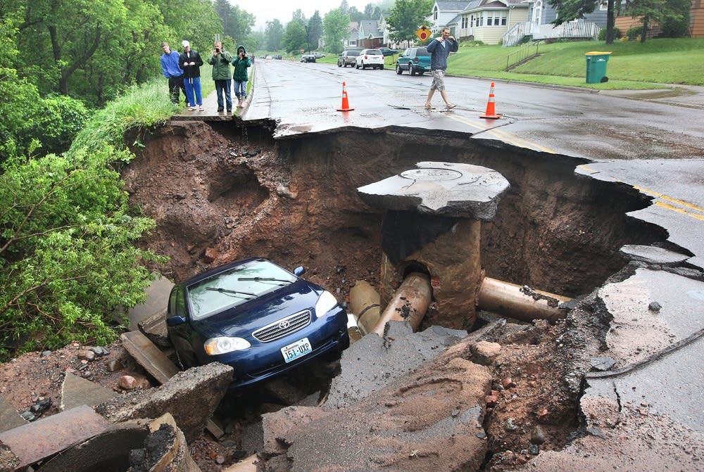A car fell into a huge sinkhole