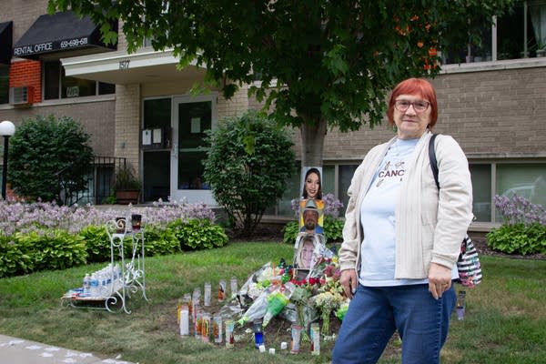 A woman in white shirt standing outside of Davern Park Apartments