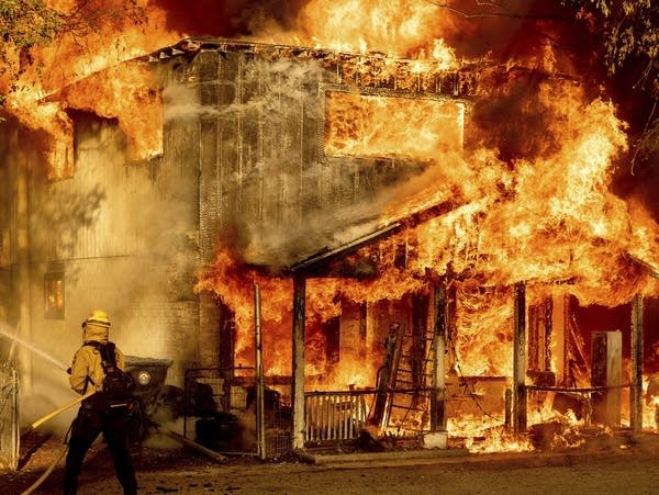 Wildfires rage in several states as heat wave broils western U.S.