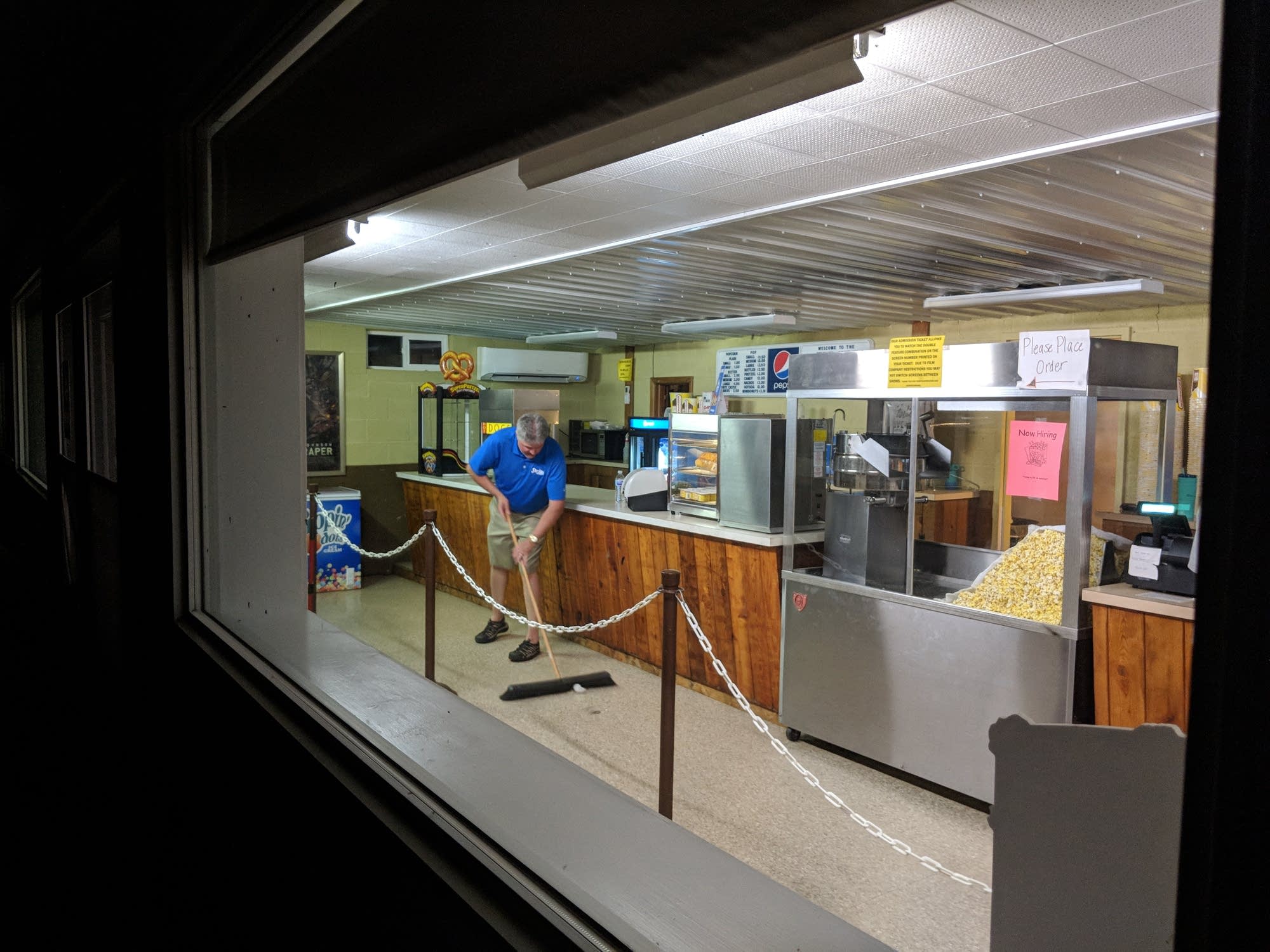 Dave Quincer sweeps the floor of the snack bar.