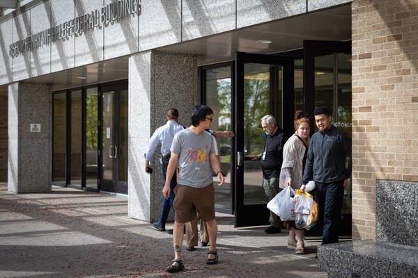 People exit a building