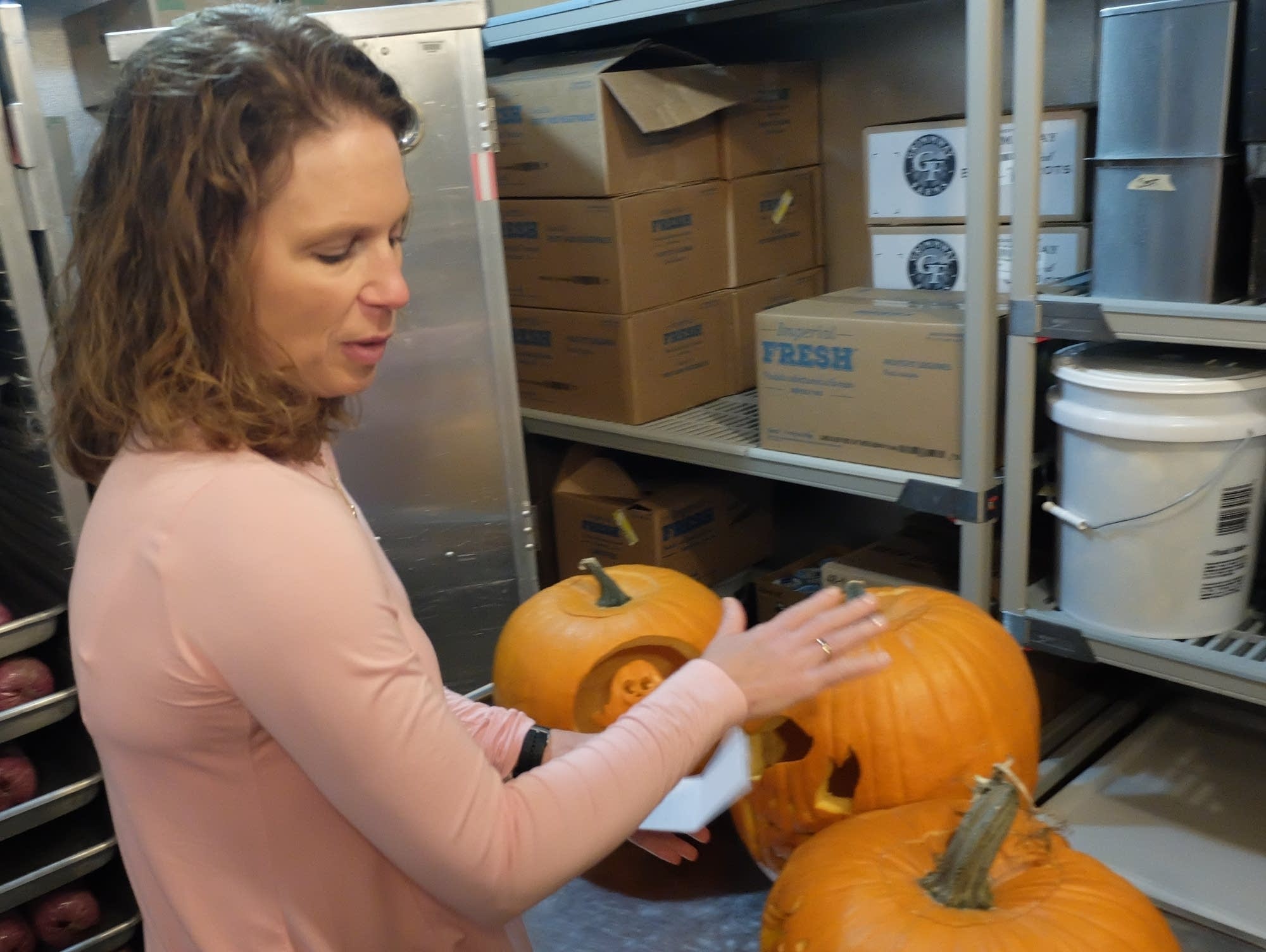 Melissa Anderson shows locally grown produce.