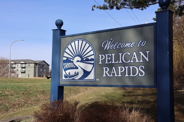 A sign reads "Welcome to Pelican Rapids."