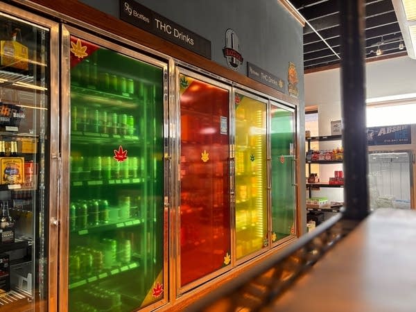Store coolers are tinted in green, red, yellow and blue.