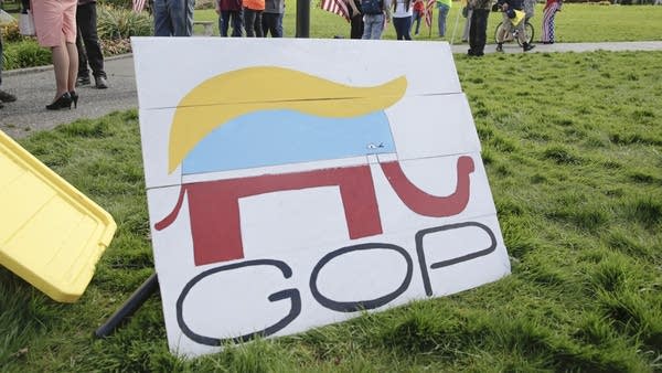 A Republican Party elephant logo is pictured with the hair of President Donald Trump during a demonstration against Washington state's stay-home order at the state capitol in Olympia, Washington, on April 19, 2020.
