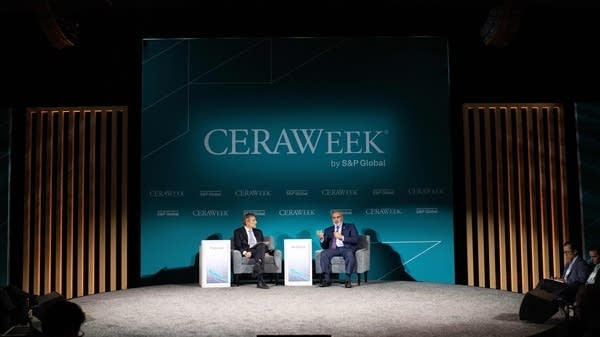 Haitham Al Ghais (R), Secretary General of OPEC, speaks with Carlos Pascual during CERAWeek by S&P Global in Houston, Texas on March 7, 2023.