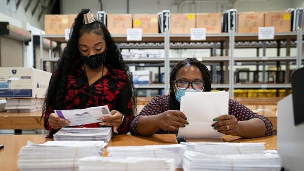 Canvassers process mail-in ballots at a county board of elections headquarters in Glen Burnie, Maryland. Canvassing is part of the election certification process.