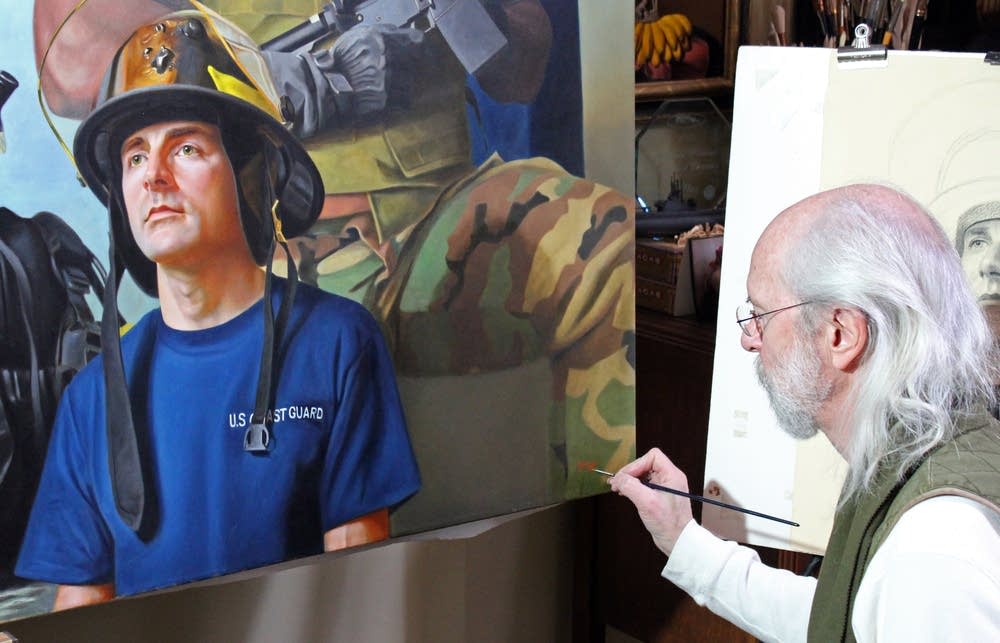 Kapsner signs his 8-by-10 foot painting.