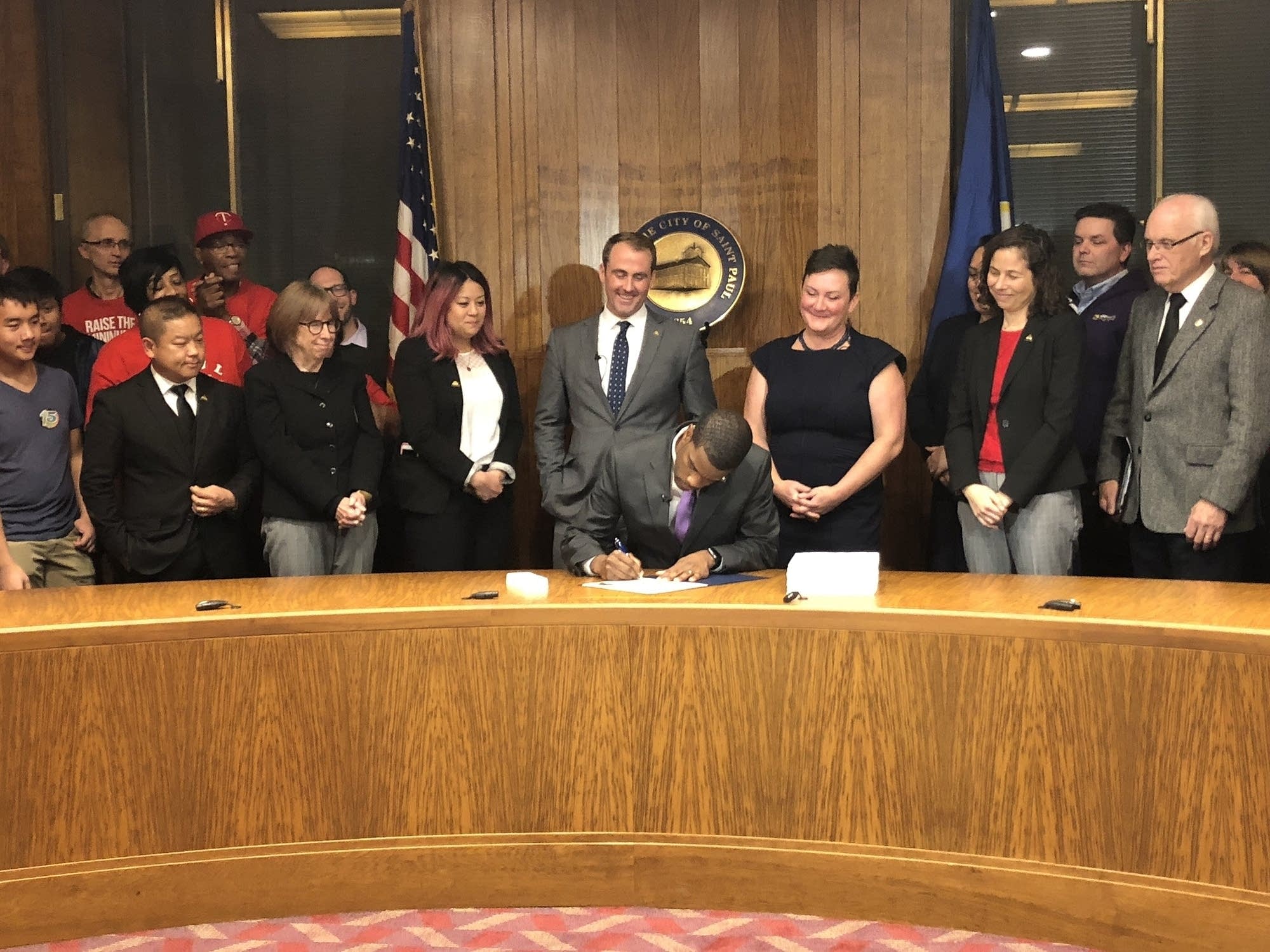 St. Paul Mayor Melvin Carter signs an ordinance