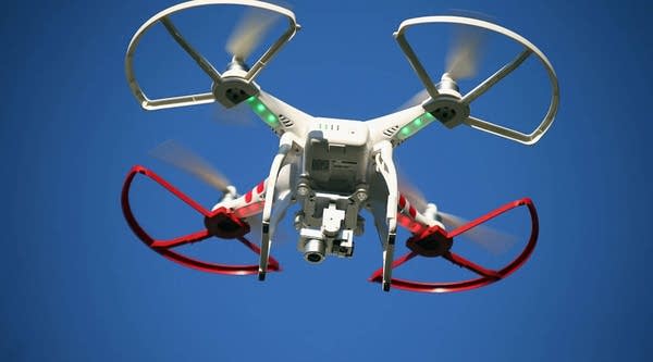 A drone is flown for recreational purposes in the sky above Old Bethpage, New York on September 5, 2015.  