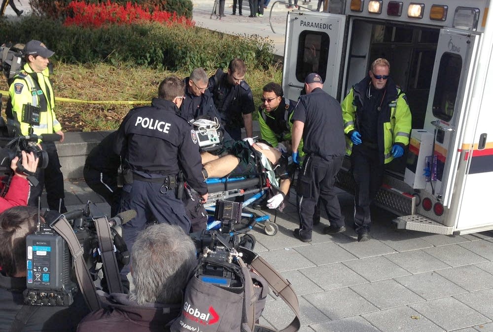 Wounded soldier moved into ambulance.