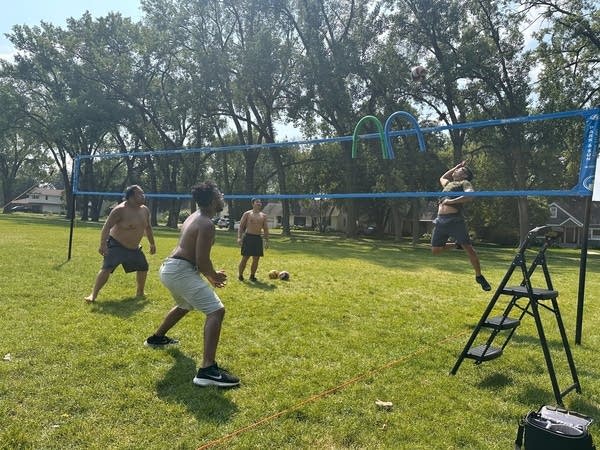 men play volleyball