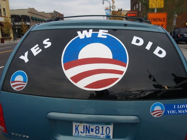 A car displays the phrase 'Yes We Did'