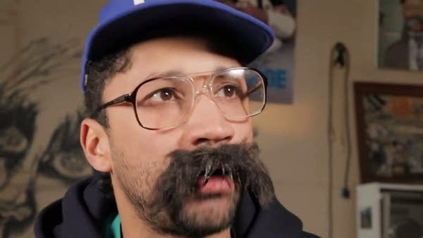 Chicago Hip Hop artist Serengeti's new album 'Dennis 6e' features raps and stories from his alter-ego Kenny Dennis. The character Dennis moves to Minnesota.