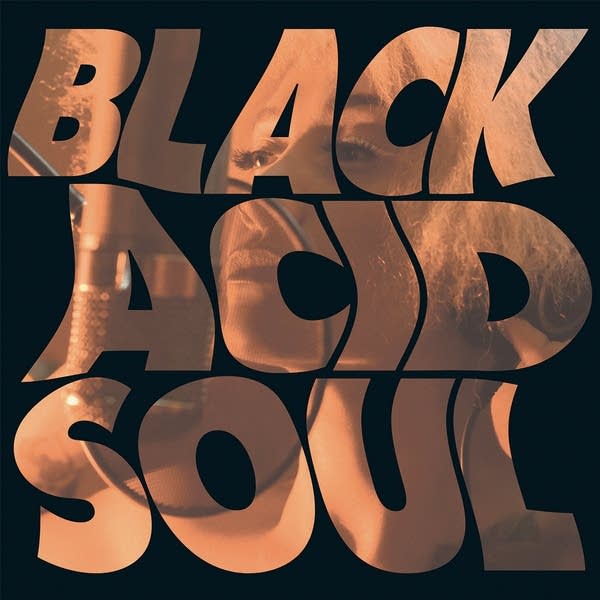 Type treatment of the words Black Acid Soul with a sublimated photo of a woman singing into a microphone