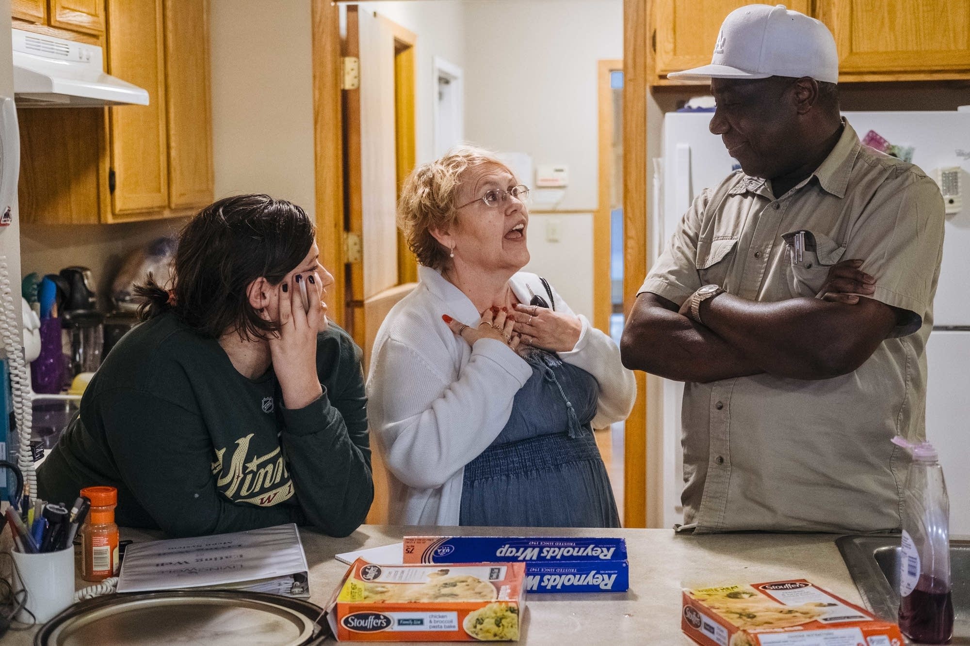 Diane Road caregivers chat in the kitchen.
