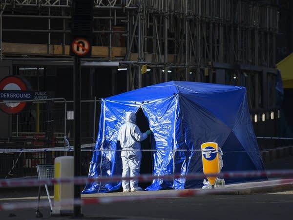 Forensic officers work in central London