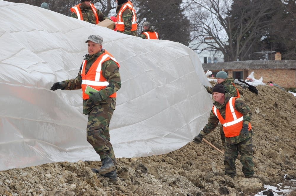 Putting plastic on a dike