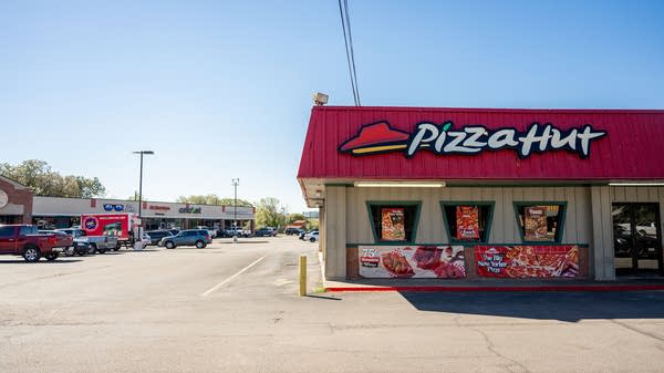 For pizza chains these days, in-house experiences are out, and cheap delivery is in. 