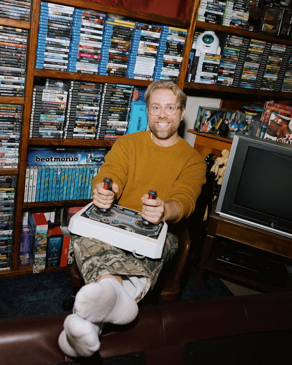 A person holding video game joysticks