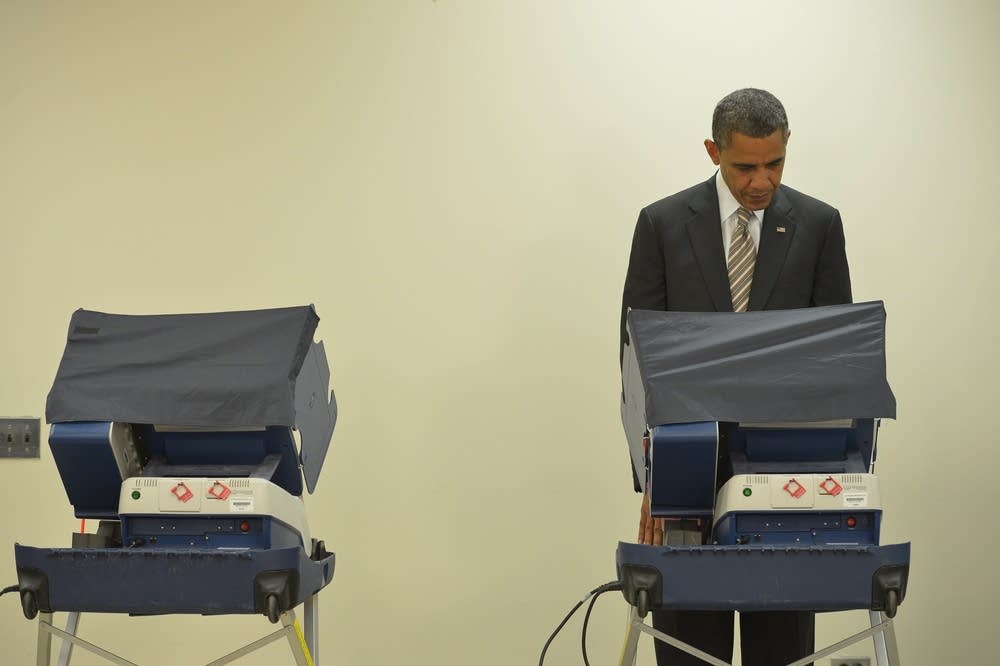 President Barack Obama casts his early ballot