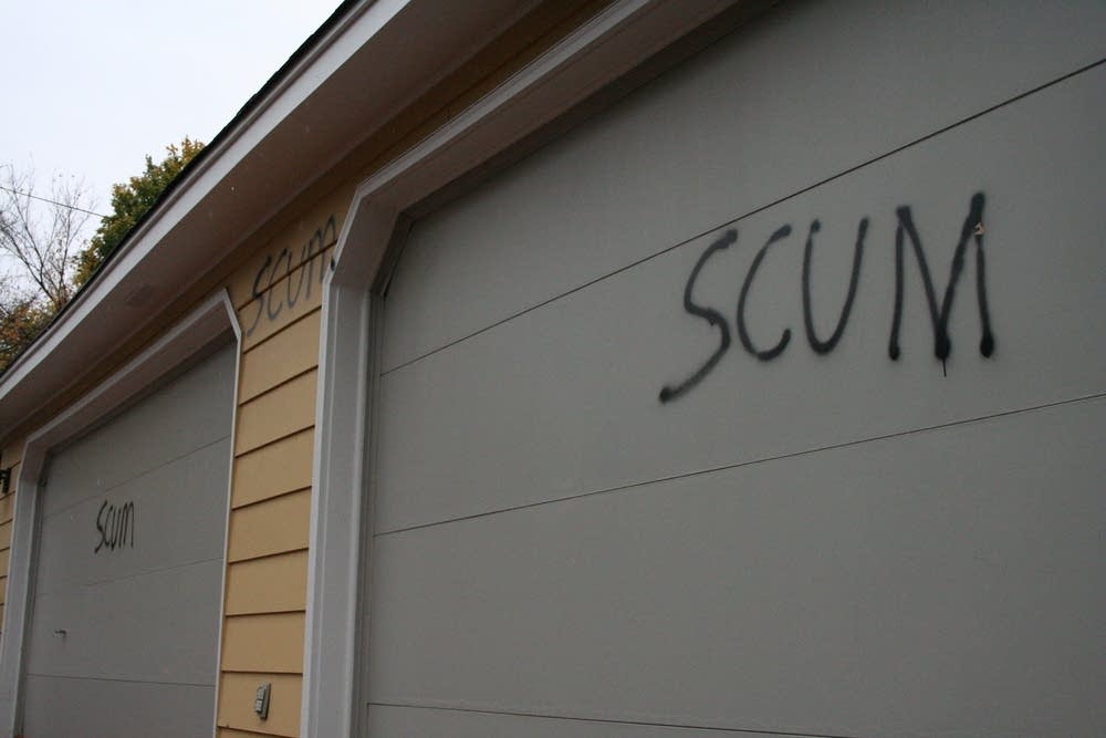 Spray paint on the front of Coleman's garage