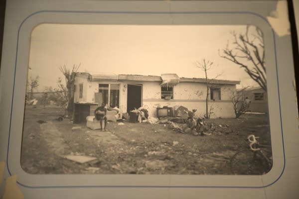 Nimmond Lockhart’s mother, Louisa, lived through Hurricane Andrew in 1992. He kept a black-and-white photo of her sitting amid the wreckage.