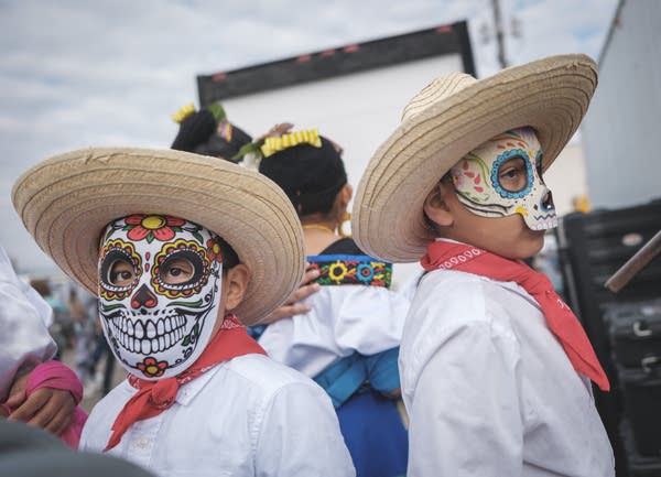 A pair of masked youngsters