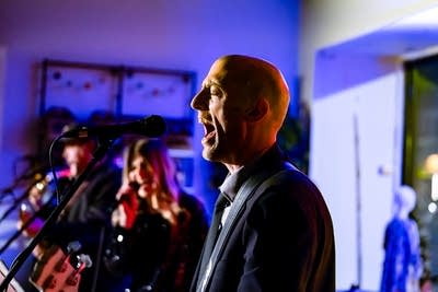 A musician sings onstage