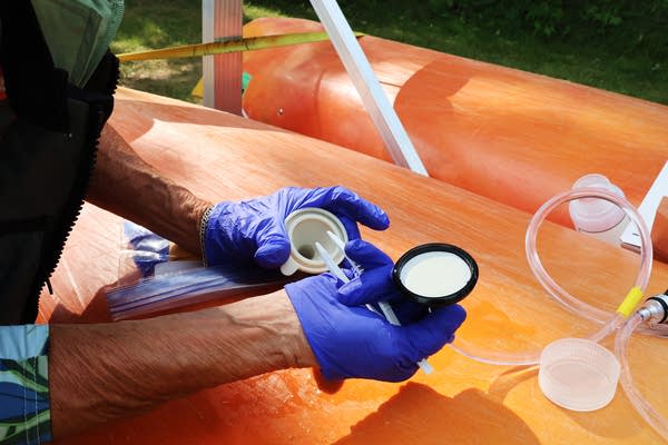 A woman prepares a sample