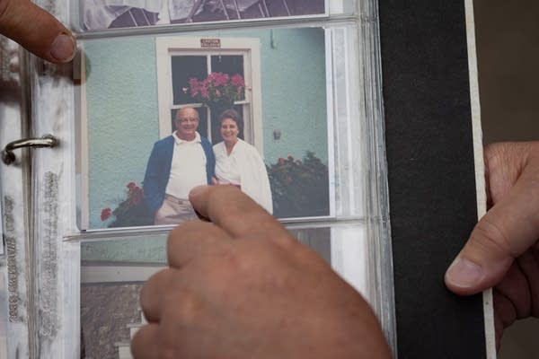 A person holds a photo album
