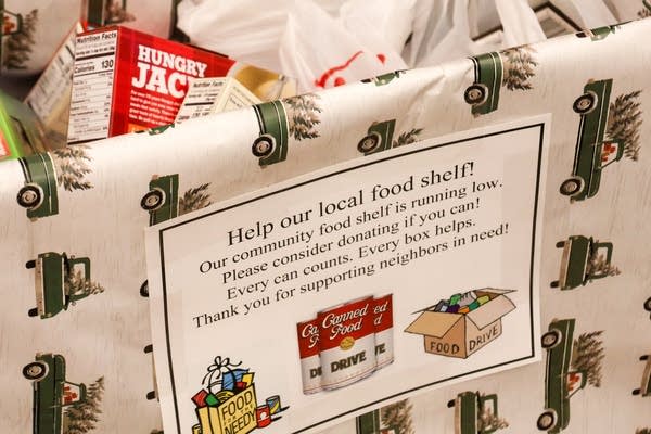 A collection basket with the sign that says