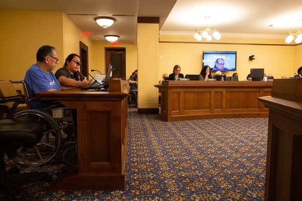 Food production worker speaks during a working group meeting