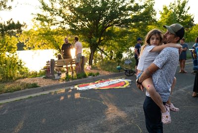 A man holds his daughter