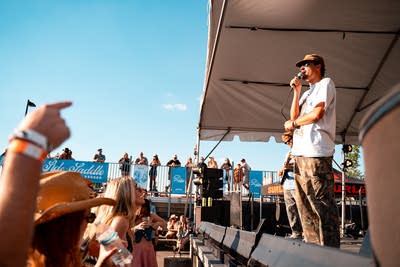 A band performing on an outdoor stage