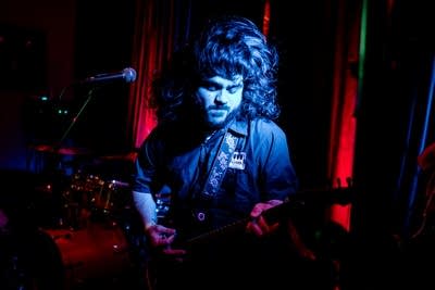 a guitarist performing on stage