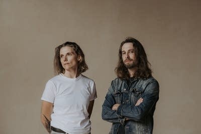 Two people standing together for a studio portrait