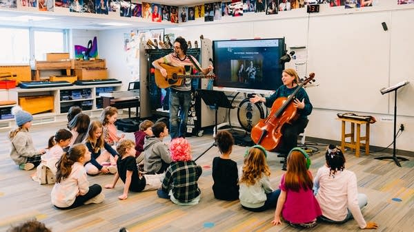 Box Cat Music plays and writes songs with a classroom of kids