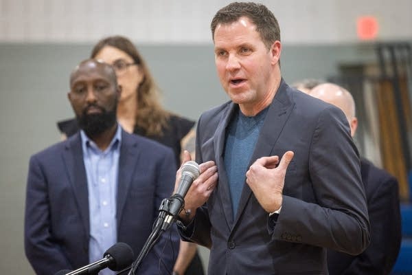 A man speaks at a press conference